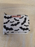 Handmade zip purse with black flying bat print on white fabric